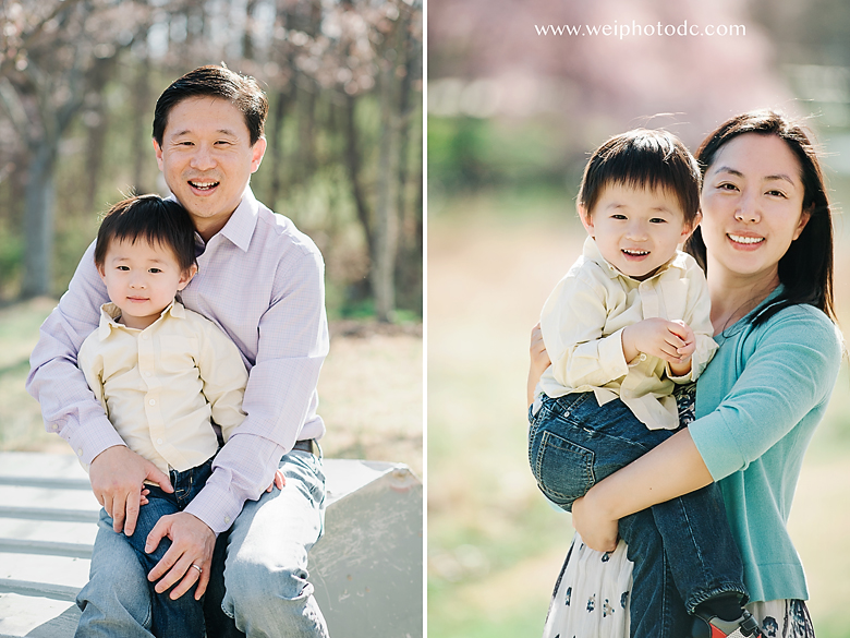 fater hold his son on the left and mother holds her son on the right